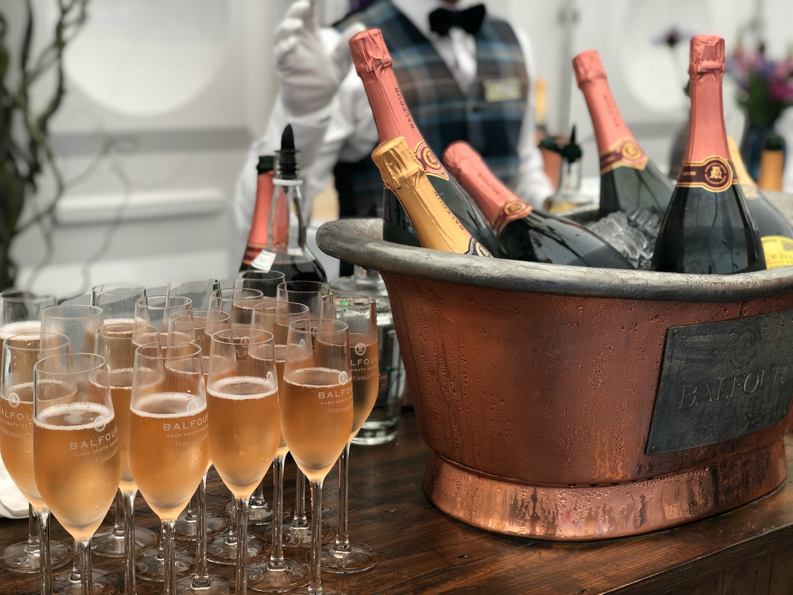 clear wine glasses beside gray steel bucket