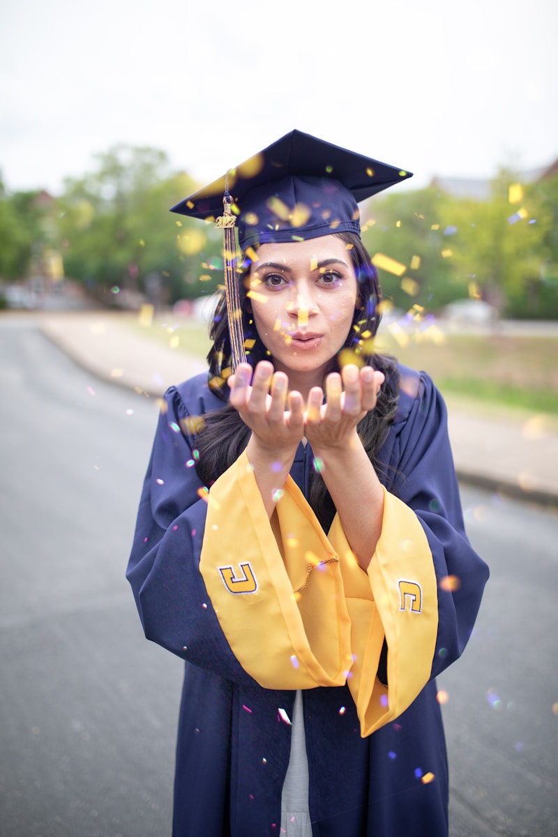 a woman in a graduation cap and gown